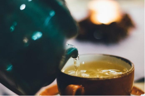 Pouring tea into a cup